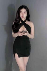 Woman in a black halter dress.