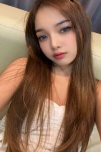 Portrait of a young woman with long brown hair.